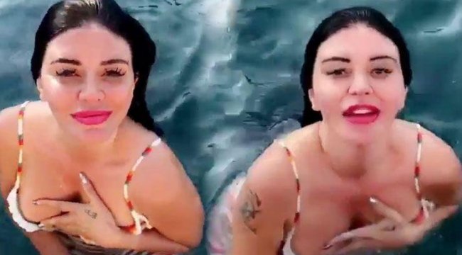 Ebru Polat kıyafetleriyle denize girdi