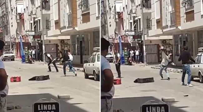 Sokak ortasında bavullu, kaldırım taşlı, sopalı kavga