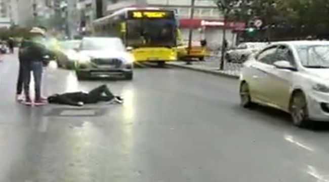 Kendini araçların önüne atarak bayılma numarası yapan dilenci böyle görüntülendi