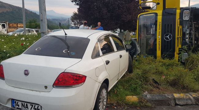 Freni boşalan asfalt kamyonu otomobile çarpıp devrildi