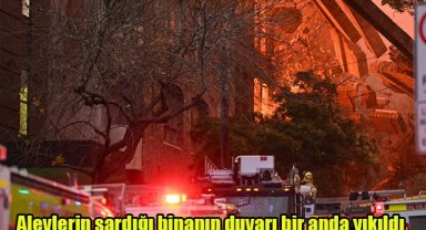 Alevlerin sardığı binanın duvarı bir anda yıkıldı