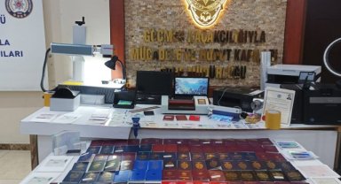 Sahte pasaport üreten şebekeye baskın