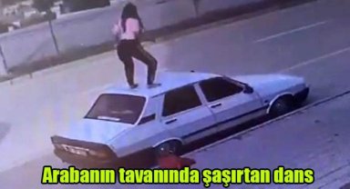 Arabanın tavanında şaşırtan dans