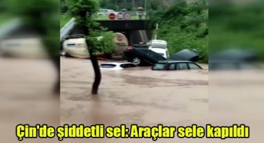 Çin'de şiddetli sel: Araçlar sele kapıldı