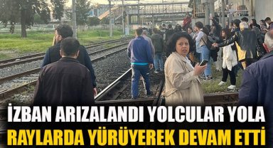 İZBAN arızalandı, yolcular raylarda yürüyerek yoluna devam etti