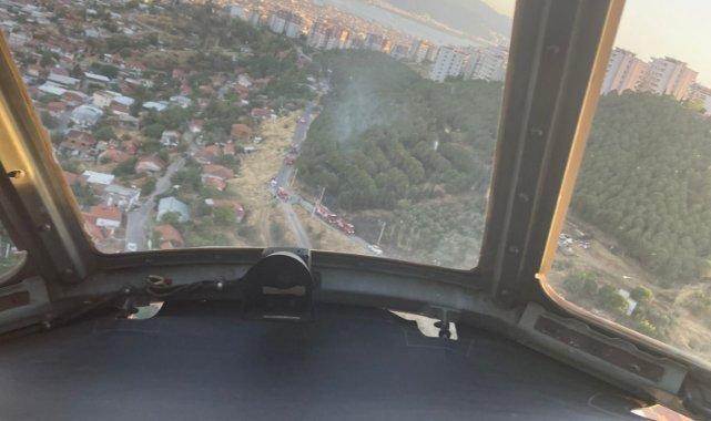 Dikili’de orman yangınına havadan ve karadan müdahale ediliyor