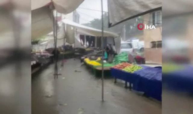 Arnavutköy’de kısa süreli sağanak yağış pazarcılara zor anlar yaşattı