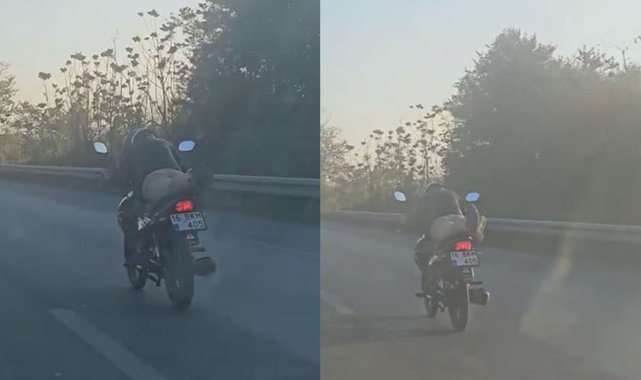 Motosikleti yatarak kullanan sürücü
