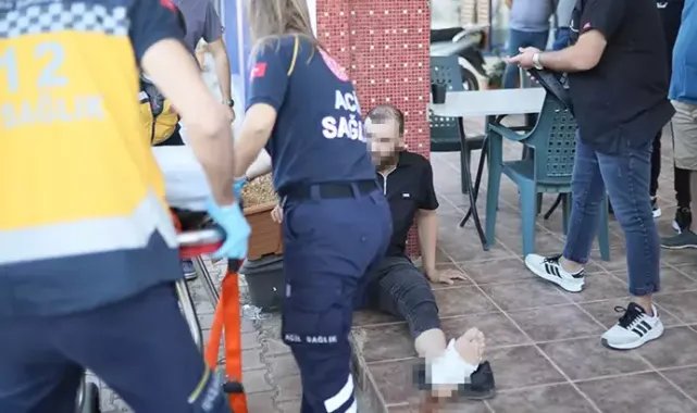 Kavgayı ayırmak isterken taraflardan biri bacağından vurdu