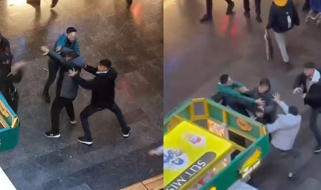 Alışveriş merkezinde güvenlik görevlileri ile gençler arasında tekme tokat kavga