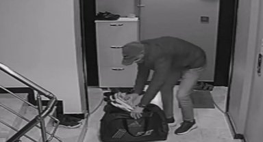 İzmir'de apartmanlara girip beğendiği ayakkabıları valize koyan hırsız yakalandı